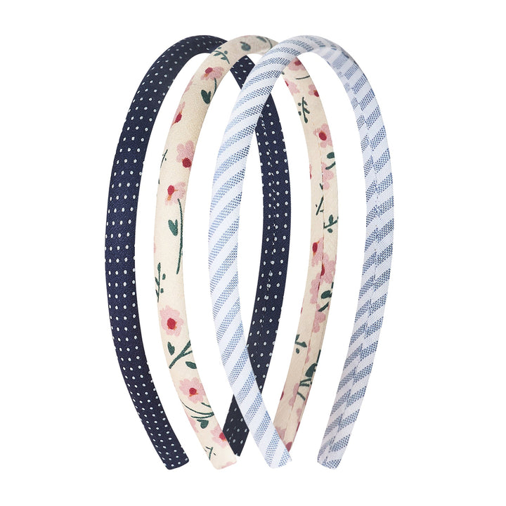 Set of three patterned headbands on a white background