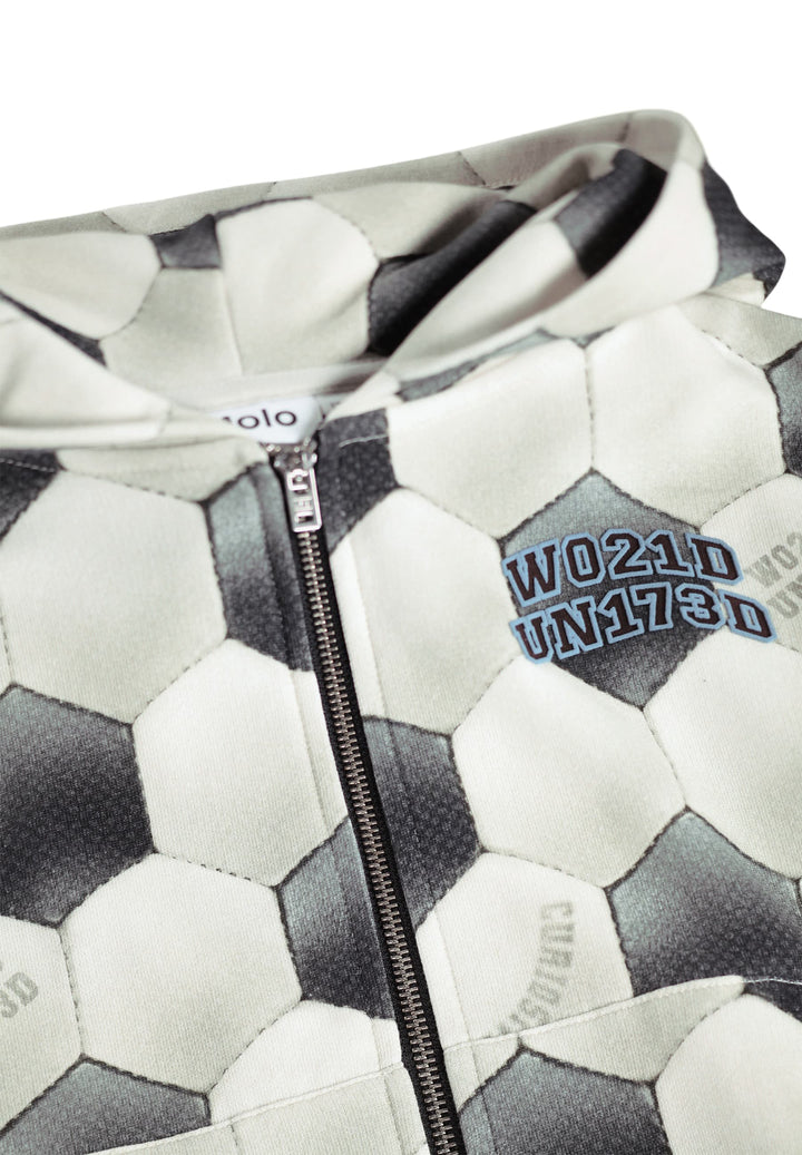 Close-up of a jacket with soccer ball pattern and visible branding