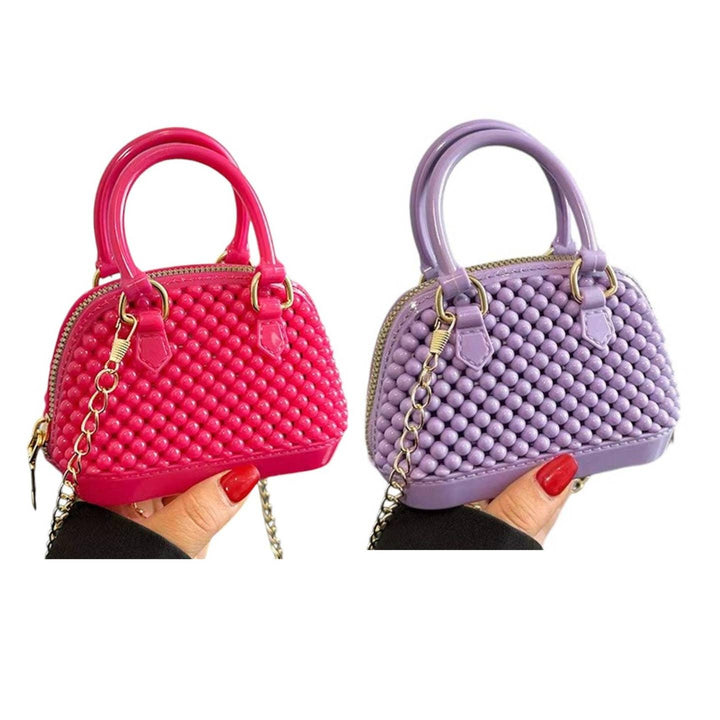 mini jelly bubble bowler crossbody bag in both deep pink and purple. 