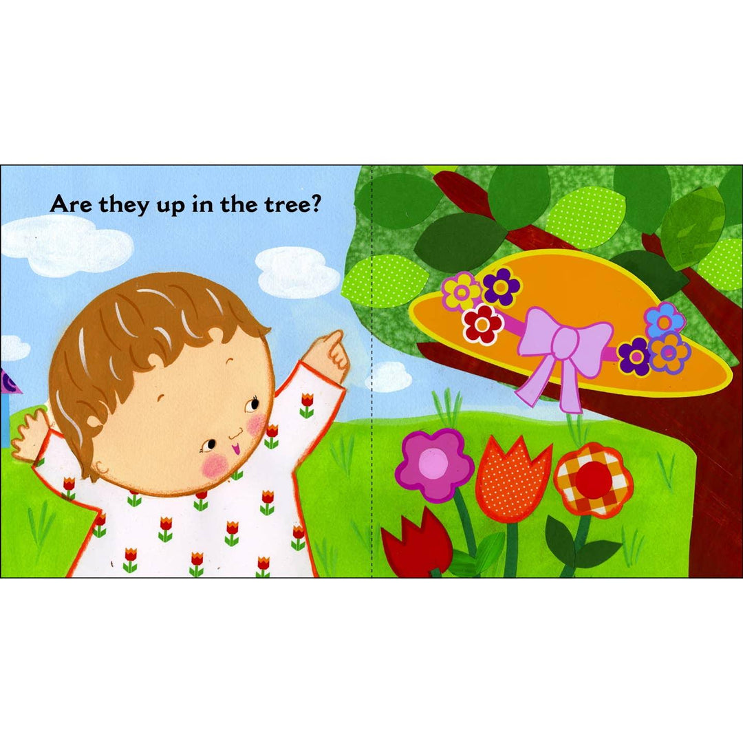 baby pointing to a tree with a hat, the hat acts as the flap to flip open. 