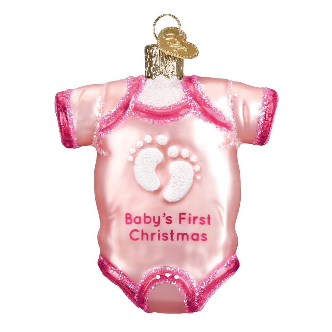Decorative ornament shaped like a baby onesie with 'Baby's First Christmas' text on a white background.