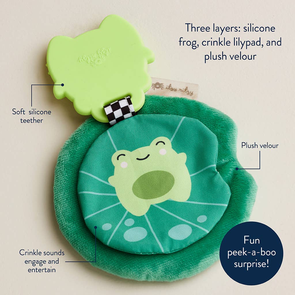 Green frog toy with crinkle sound feature on a beige background