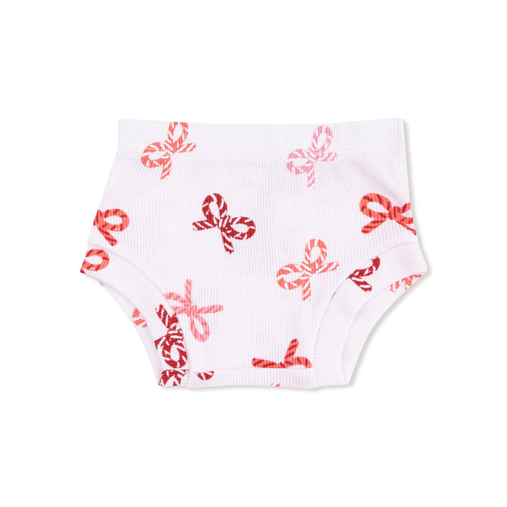 White baby bloomers with red candy cane bow pattern on a white background