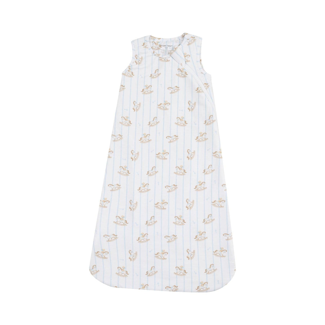 baby sleeping bag with vintage rocking horses all over and thin blue stripes going al throughout the sleep bag