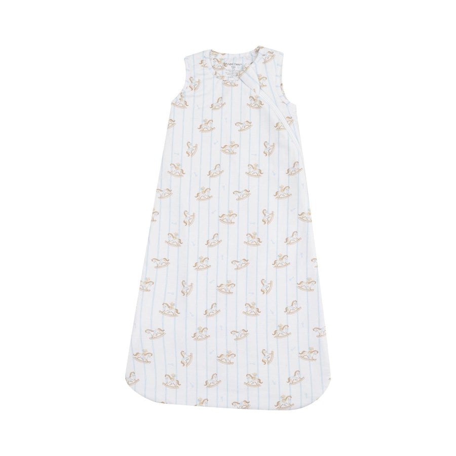 baby sleeping bag with vintage rocking horses all over and thin blue stripes going al throughout the sleep bag