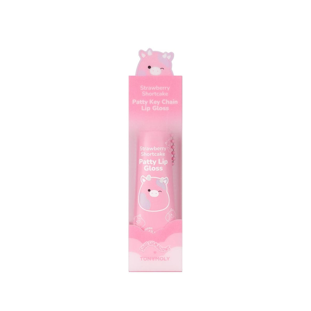 lip gloss in the shade of pink attached to a chainlink in packaging with the squishamllow cow charachter attached to it/on the box. 
