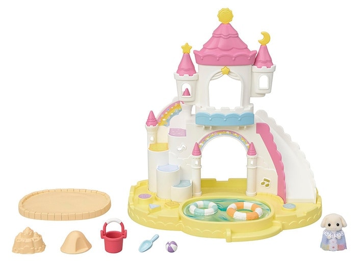 Toy sandcastle with slides and accessories on a white background
