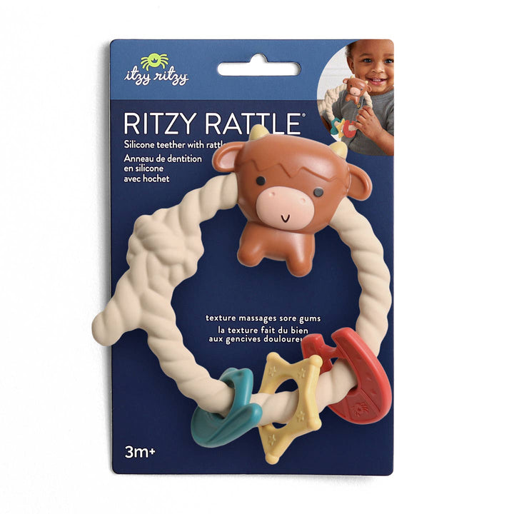 Ritzy Rattle baby teether with packaging featuring a child holding the teether.