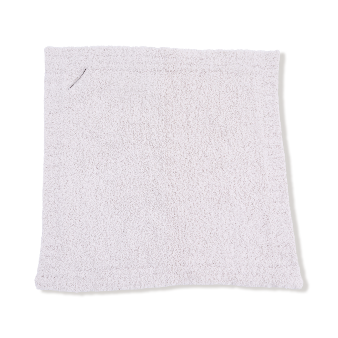 White textured blanket on a white background