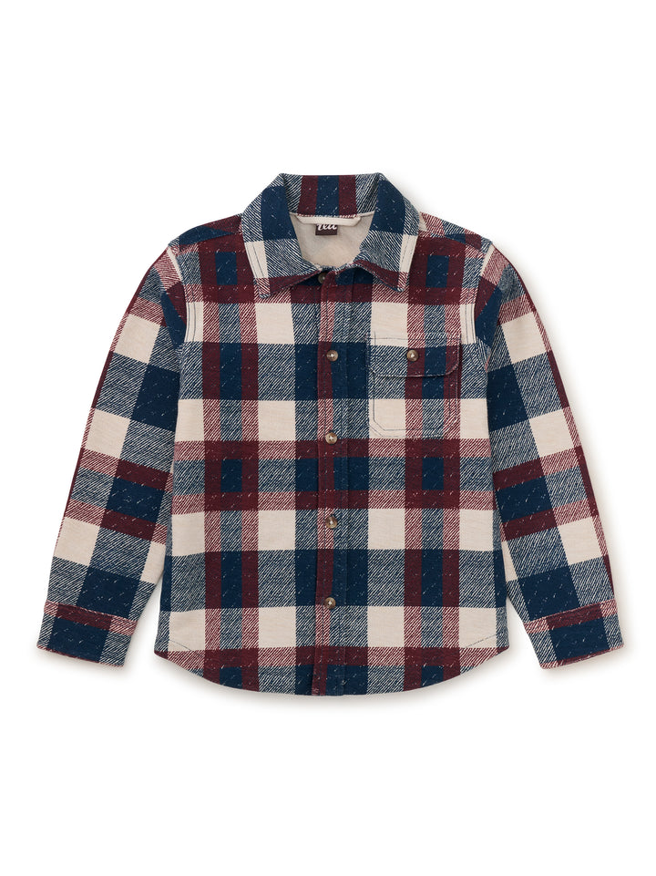Plaid shirt with red, blue, and white pattern on a white background