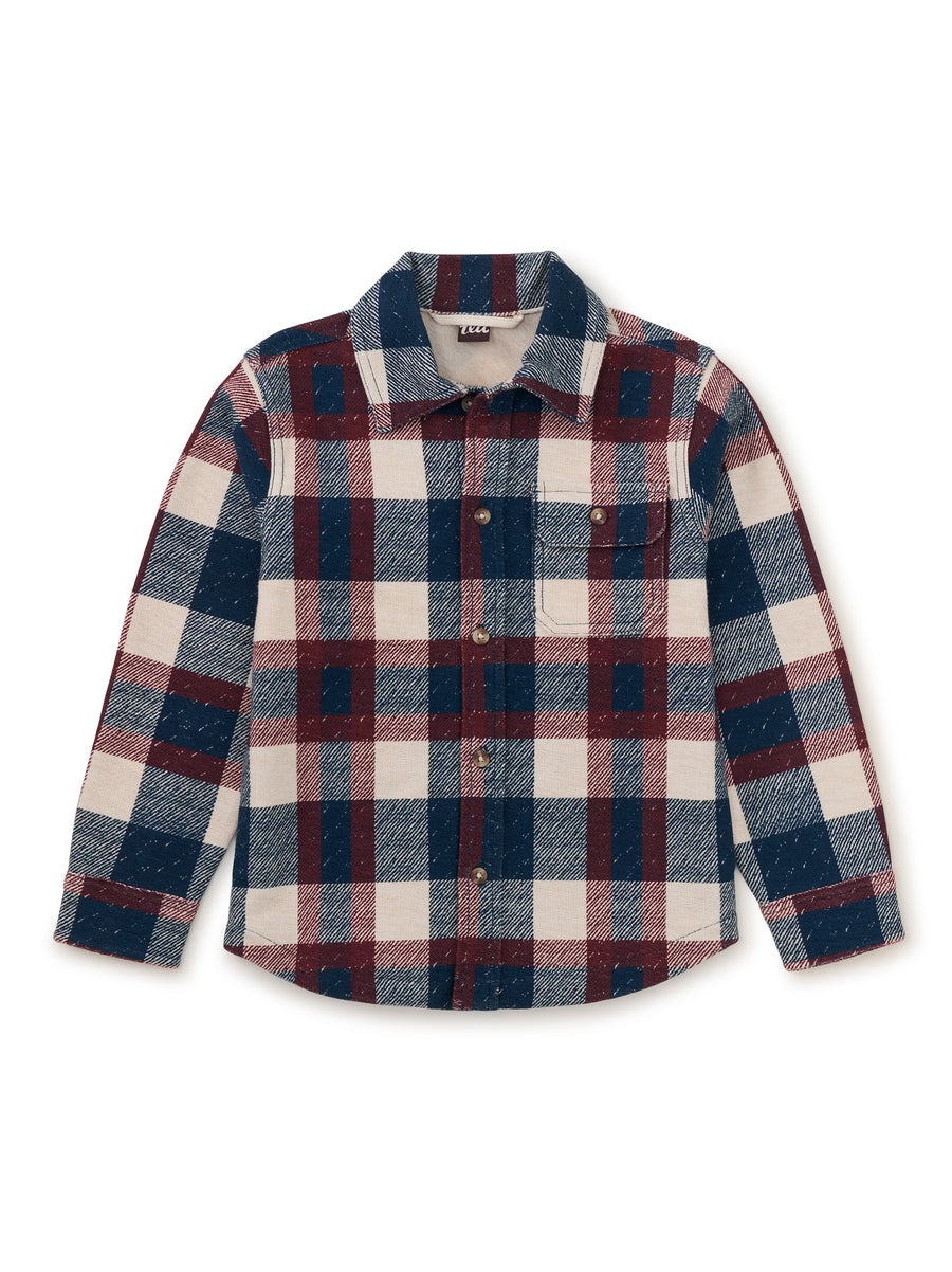 Plaid shirt with red, blue, and white pattern on a white background