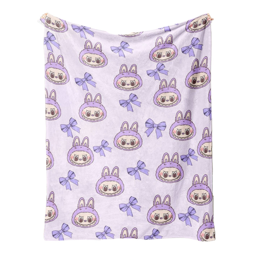  a blanket with a labubu cartoon character pattern and purple bows