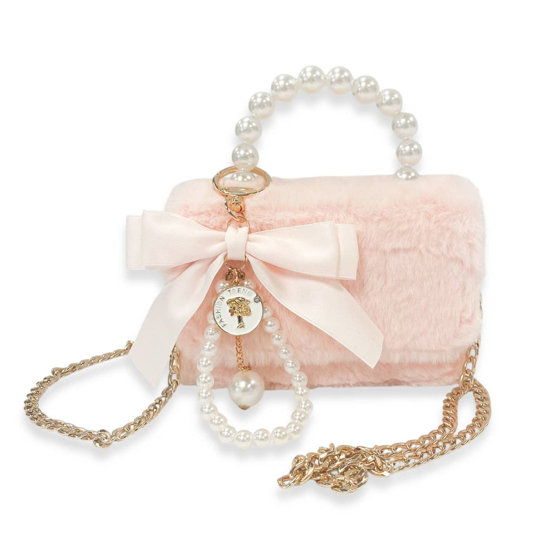 Pink handbag with pearl handle and chain strap on a white background