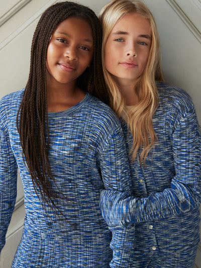 Two Tween Girls in Molo's Camille Long Sleeve Dress in Blue Mouline Print