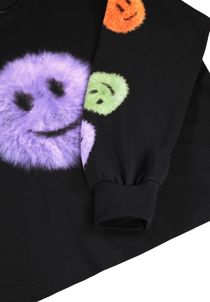 Black shirt with colorful smiley face designs on a white background