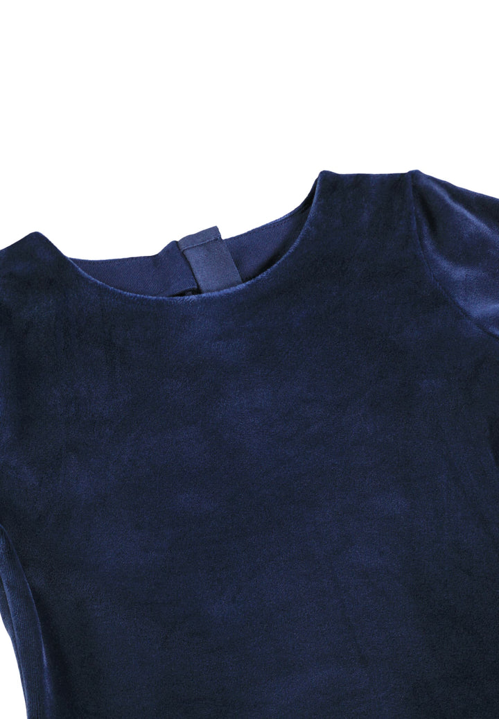 Close-up of a dark navy blue velvet top showing the crew neckline and inner neck label against a plain white background.