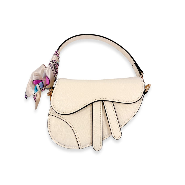 Beige saddle bag with a colorful scarf on a white background