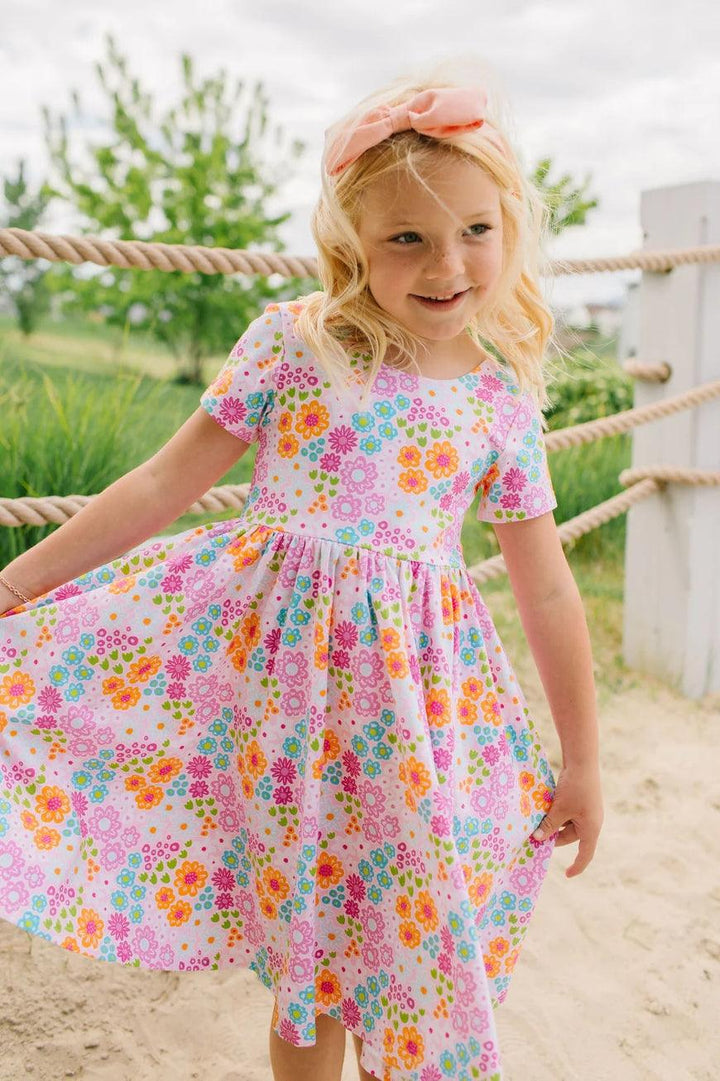 close up of the colors and the print in the dress. short sleeve, scoop neck, knee length