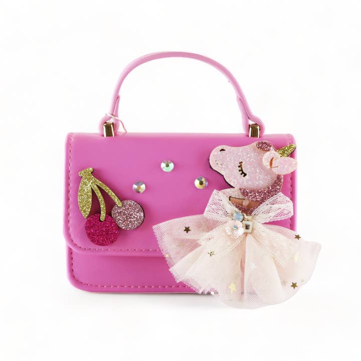 fuchsia handbag with unicorn applique and cherry applique and some rhinestones