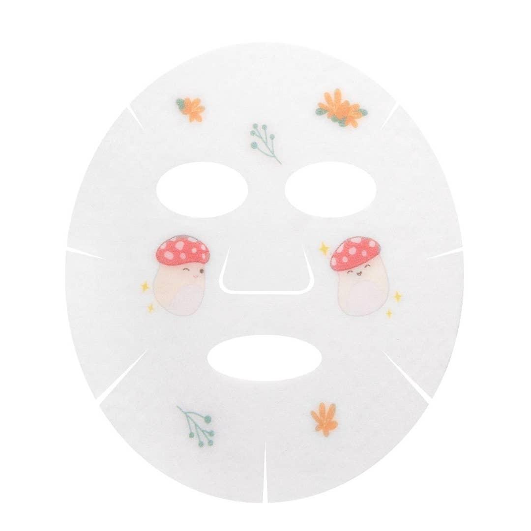 the actual sheet mask has malcolm the mushroom on it with some gold flowers on it. 