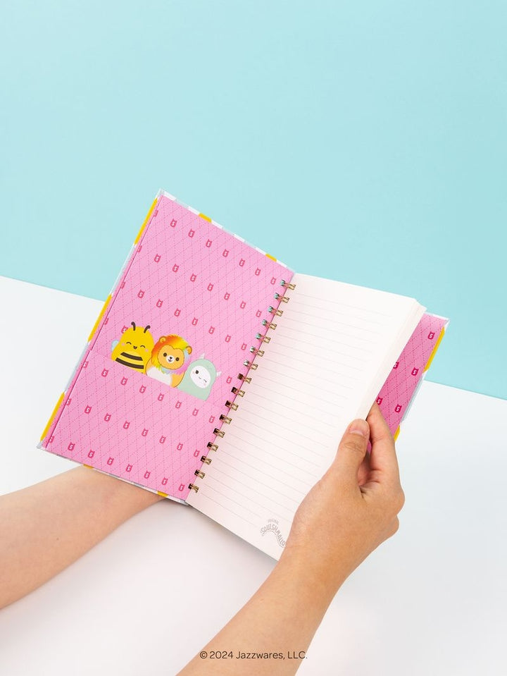 squishmallow notebook with the inside cover being Pink notebook with cartoon character 