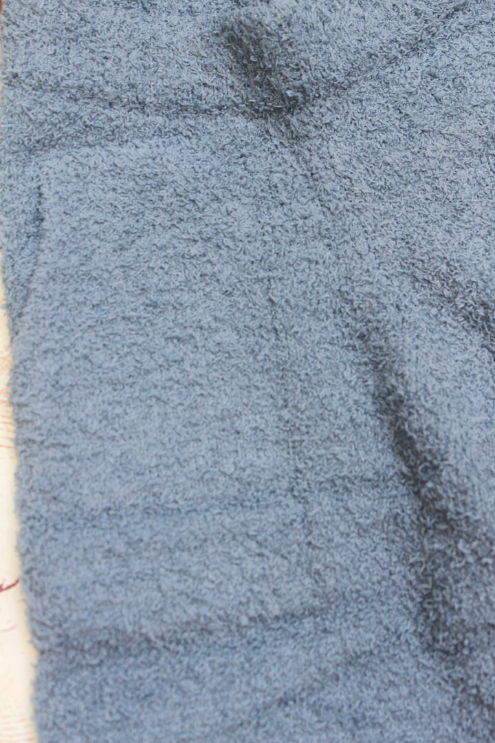 Close-up of a textured blue fabric surface