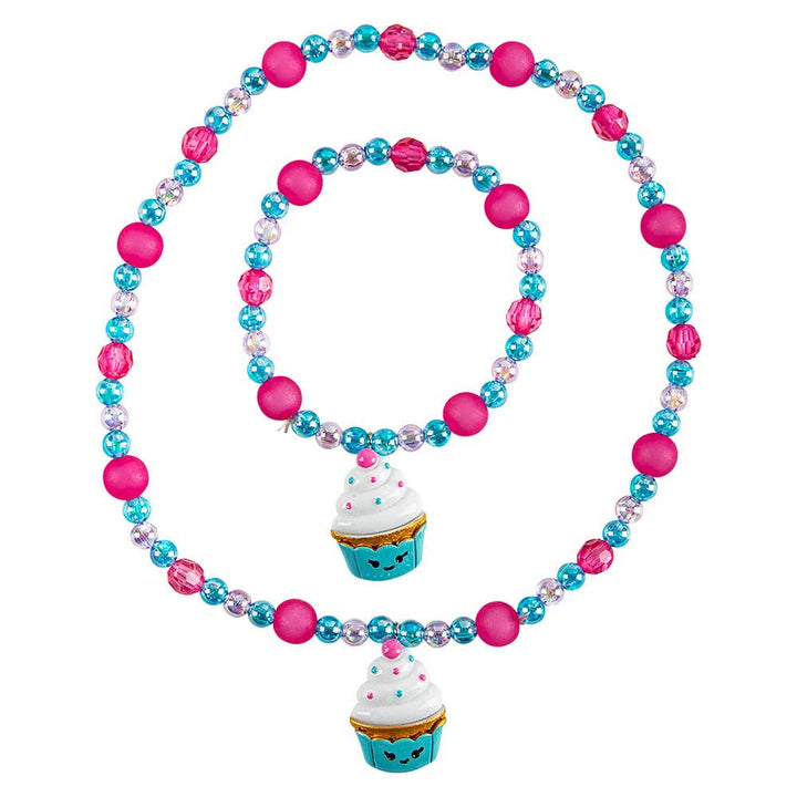 Colorful beaded necklace with cupcake charms on a white background