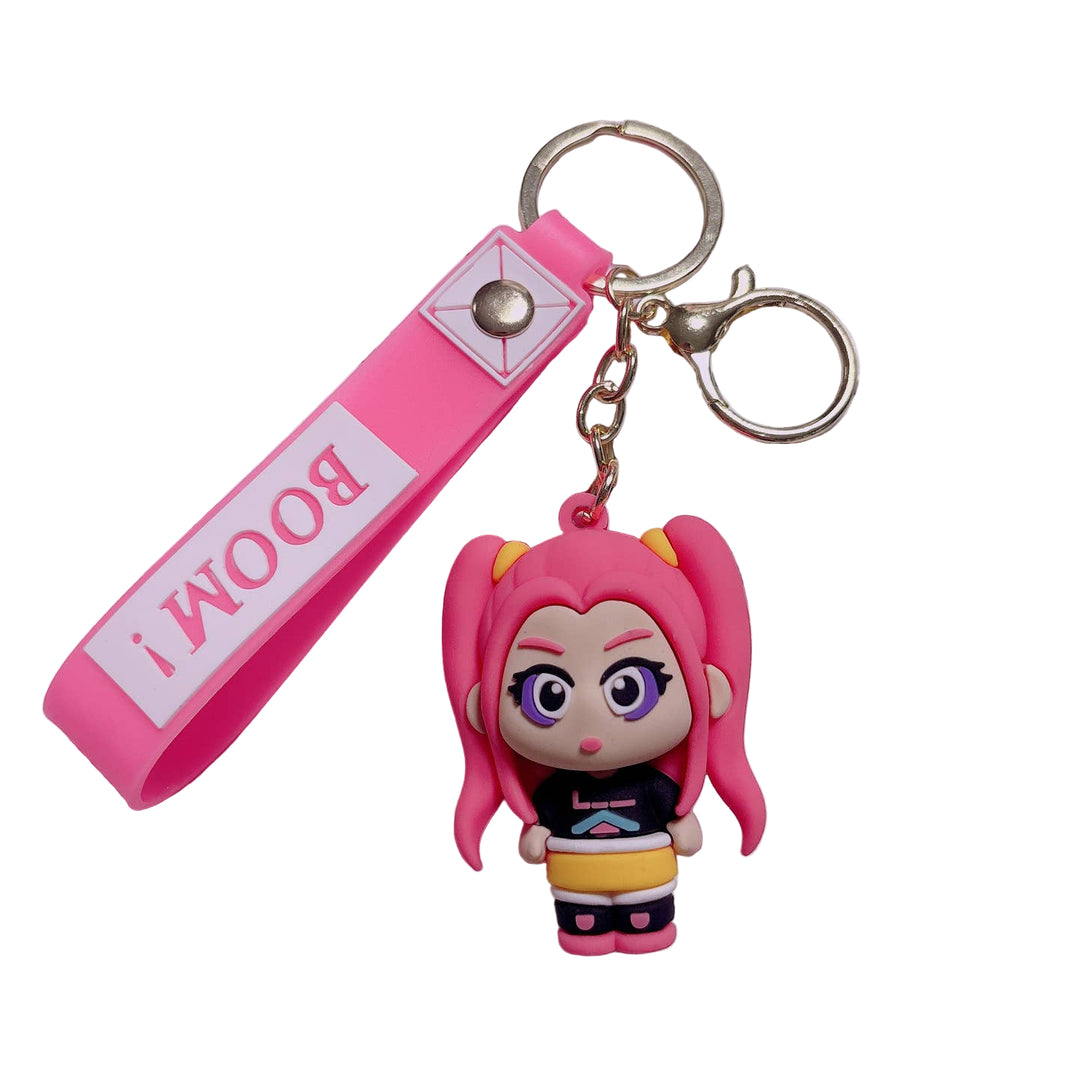 Keychain with cartoon character and 'BOOM!' tag on a keyboard