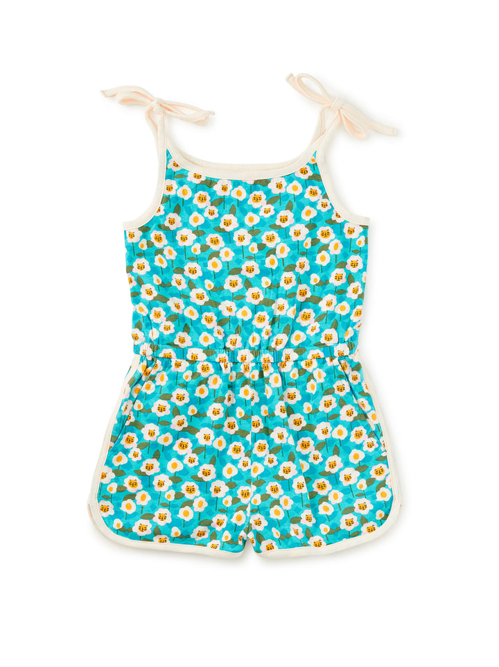 Children's romper with daisy pattern on a white background