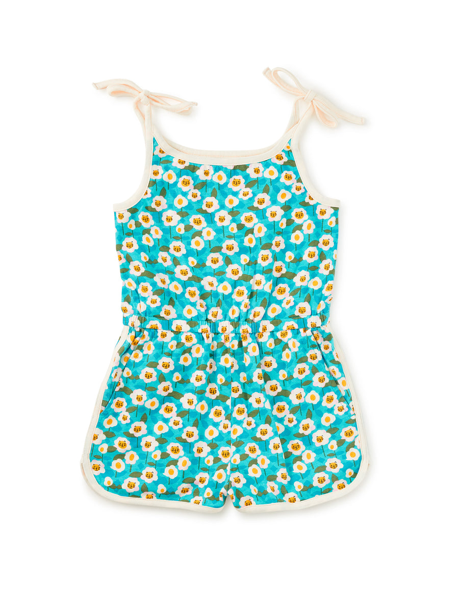 Children's romper with daisy pattern on a white background