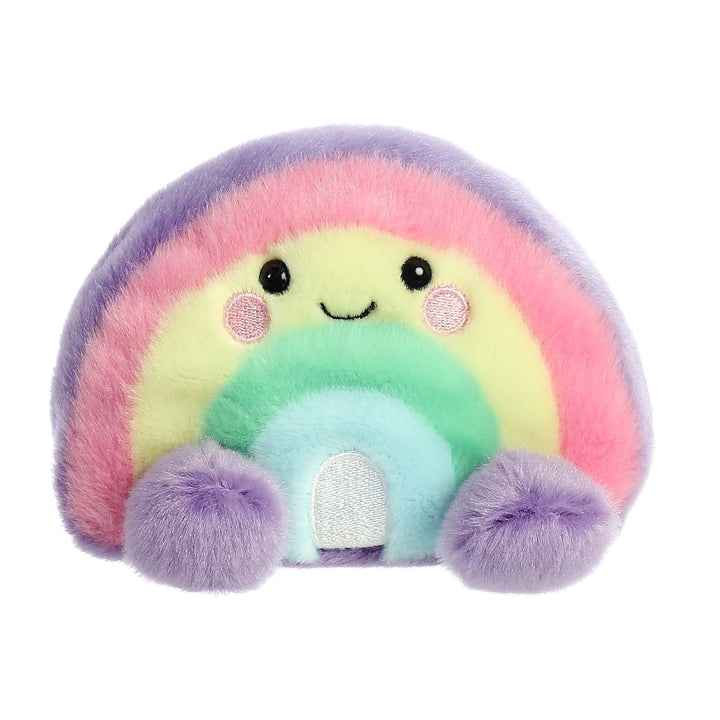Plush toy shaped like a rainbow with a smiling face on a white background