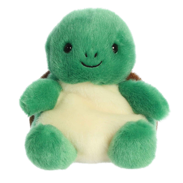 Green plush turtle toy on a white background