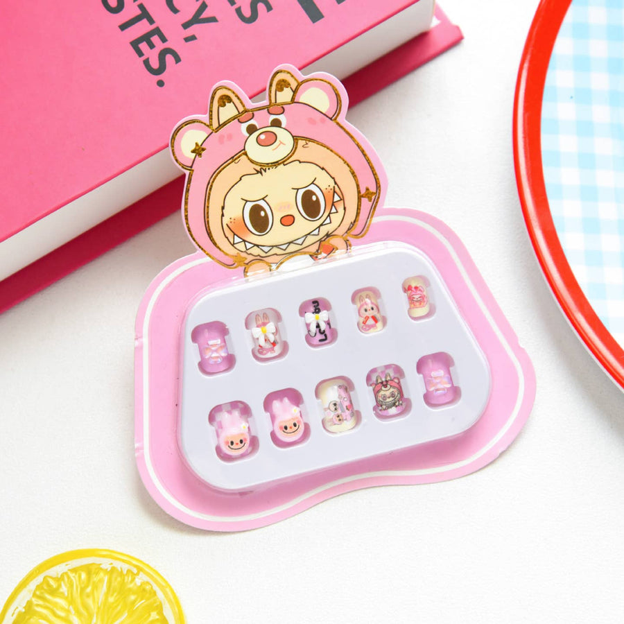 Set of small press on nails with a cartoon character design in a pink case on a white surface.