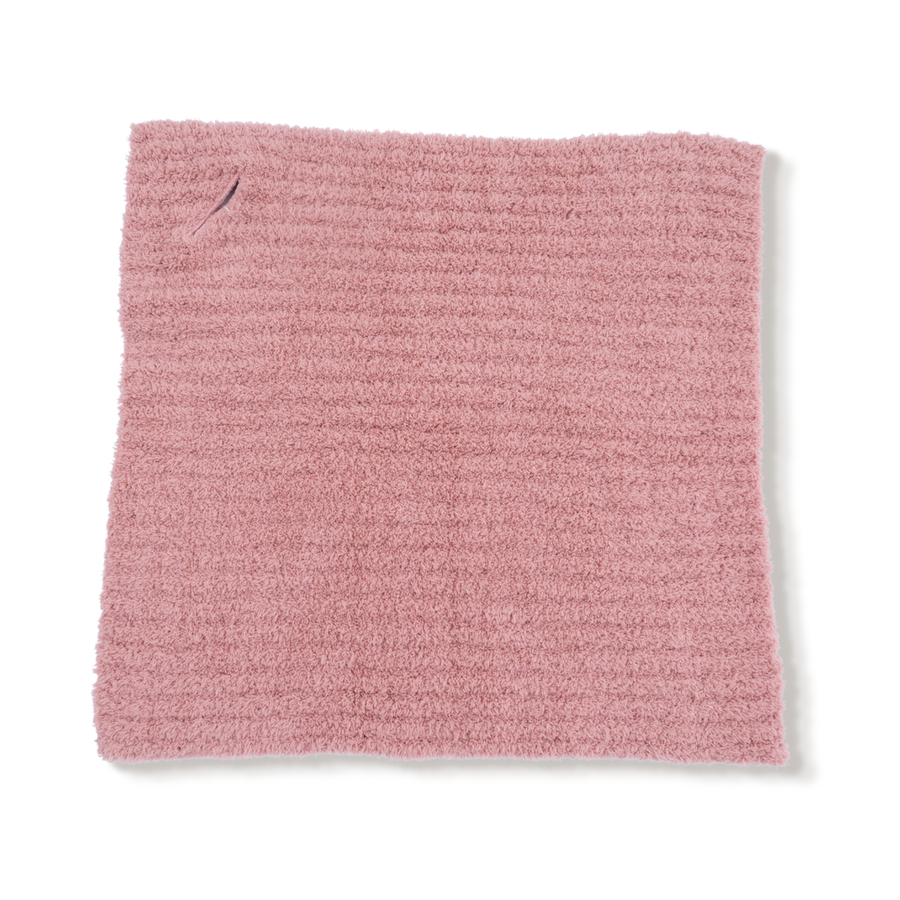 Pink textured fabric square on a white background