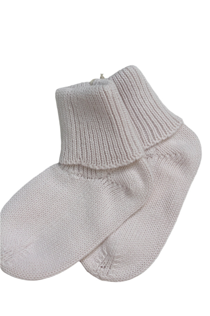knit baby socks in creme color in a foldover style. 