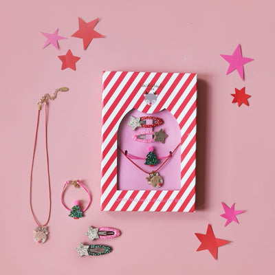 shot of snap clips with stars attached, a christmas tree on a bracelet and reindeer on the necklace