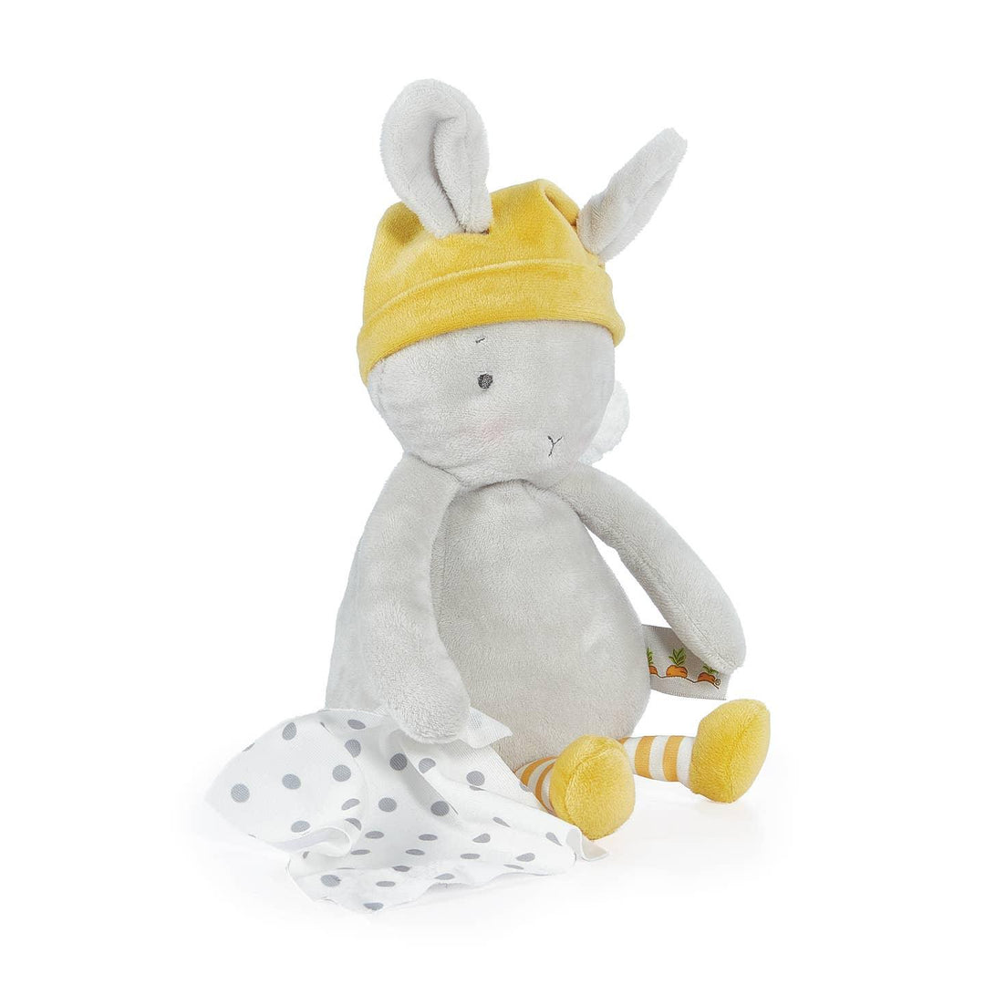 bunny sitting on the side. soft gray bunny with yellow hat and yellow and white striped legs. 