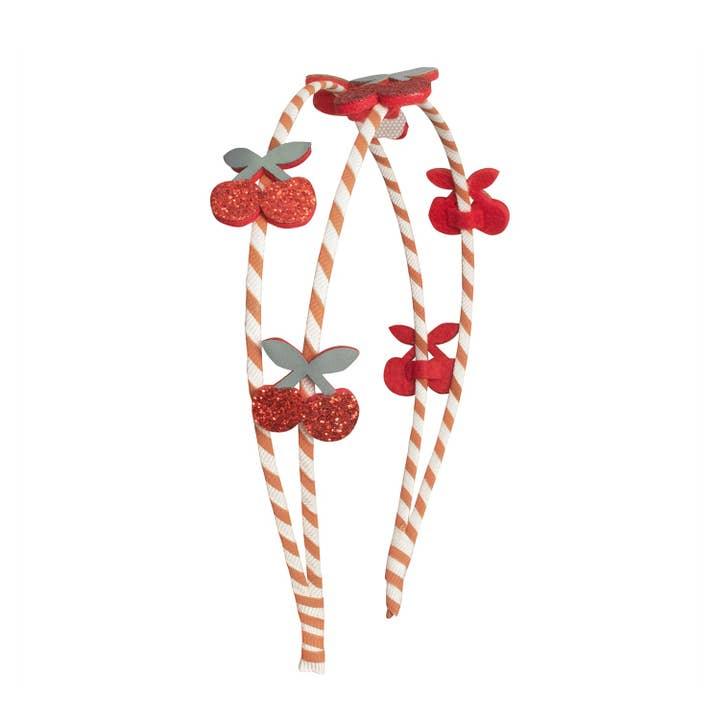 orange and beige striped ribbon wrapped around the headband with cherries 