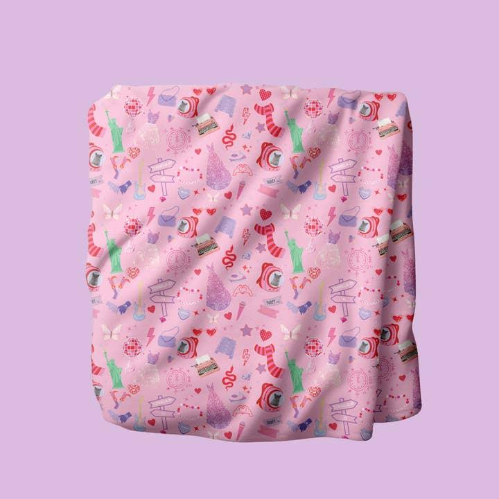 soft pink plush blanket with Taylor Swift inspired print