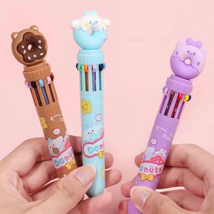 3 different color options for these retractable pens: blue, purple, brown each with a donut on top