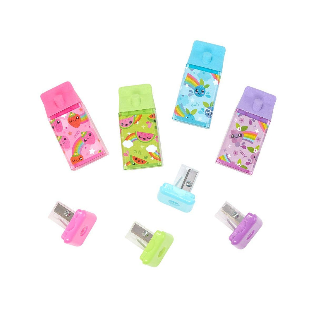 this picture shows the eraers and pencil sharpeners. the sharpeners are at the bottom of the eraser. the eraser is shaped like a juice carton and comes in pink, purple, blue and green