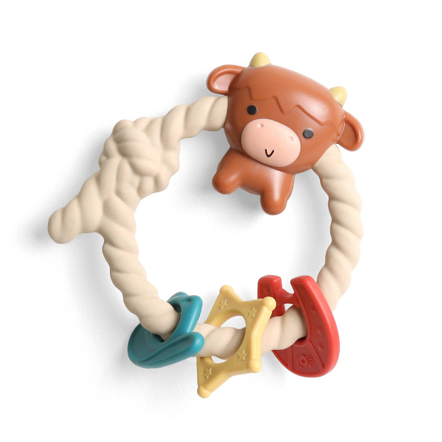 Teething ring with cow design and colorful handles on a white background