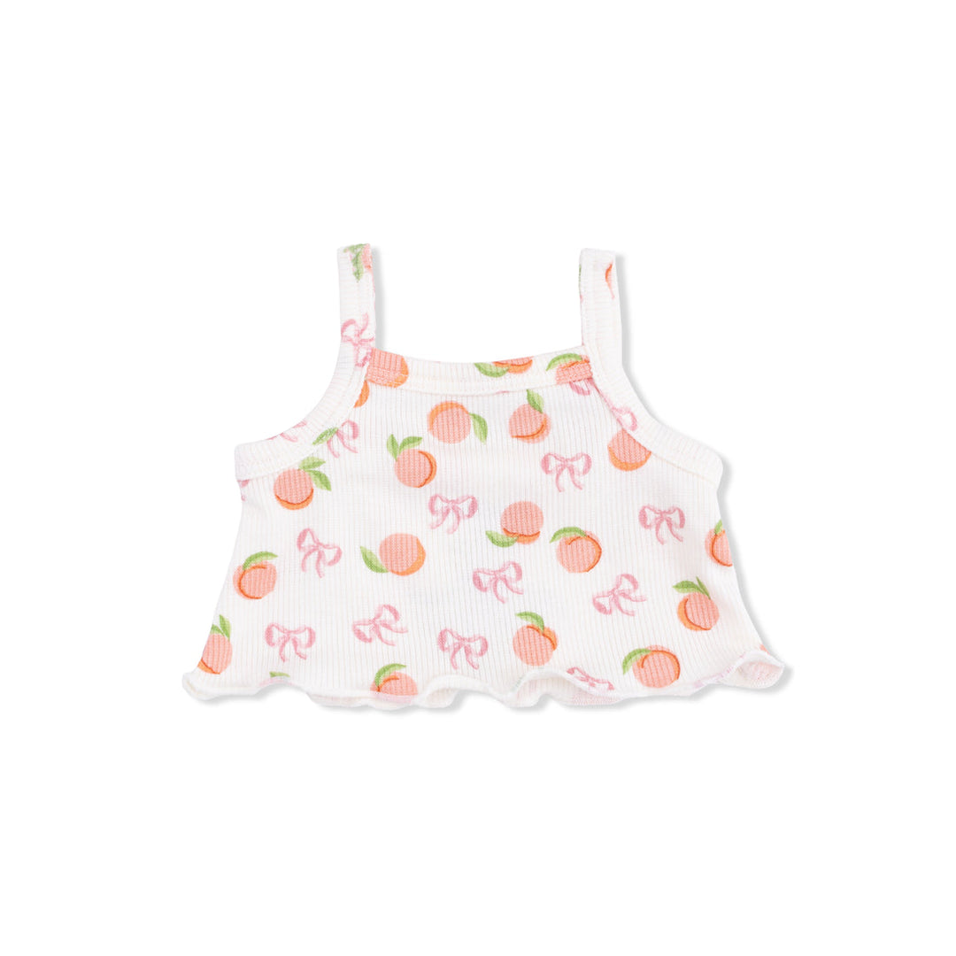 White tank top for baby with peach and bow pattern on a white background