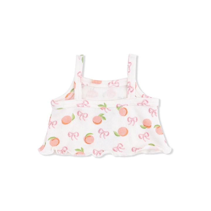 Back of White tank top with peach and bow pattern on a white background