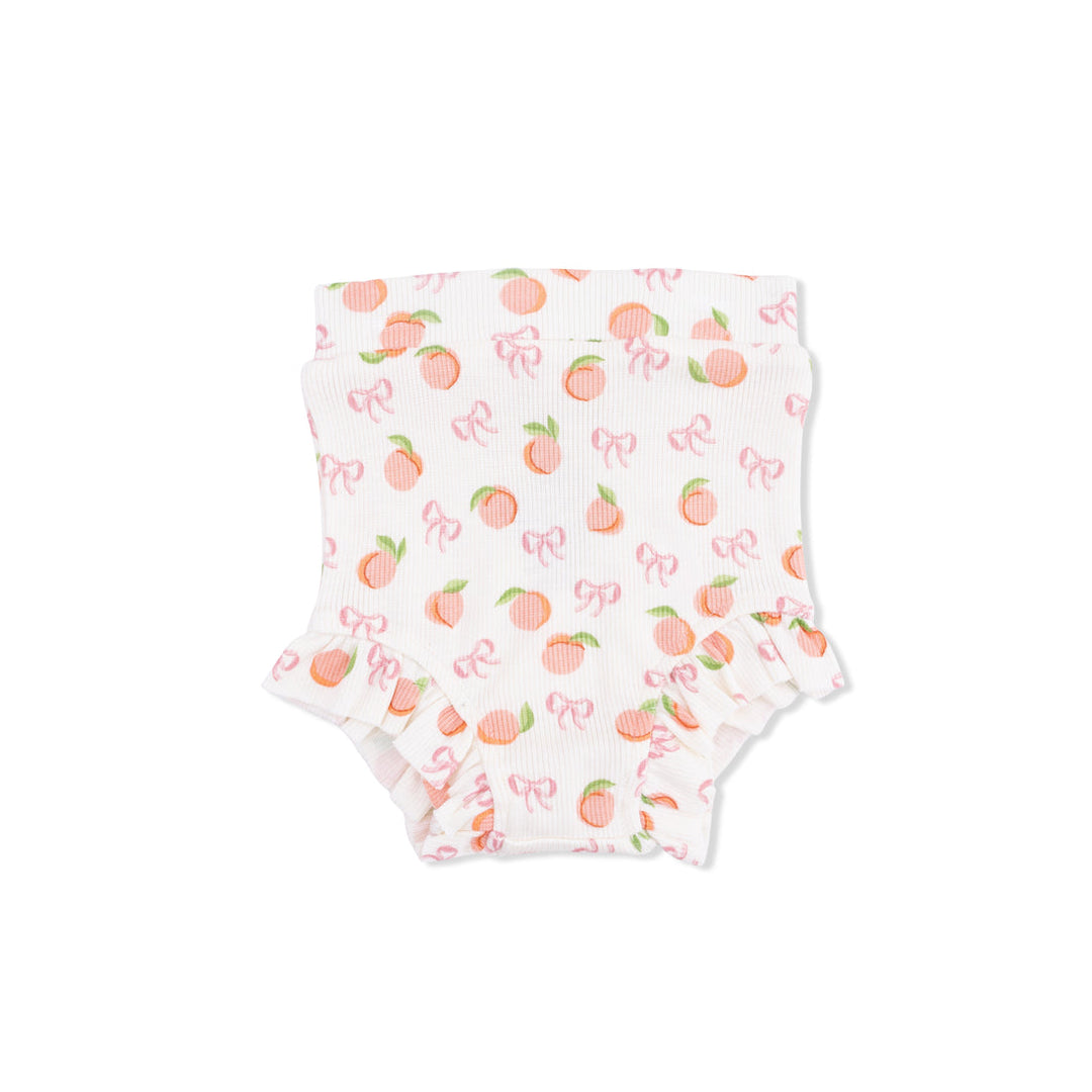 Baby bottoms with peach and bow pattern on a white background