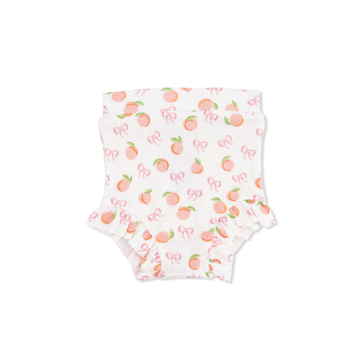 Baby bottoms with peach and bow pattern on a white background