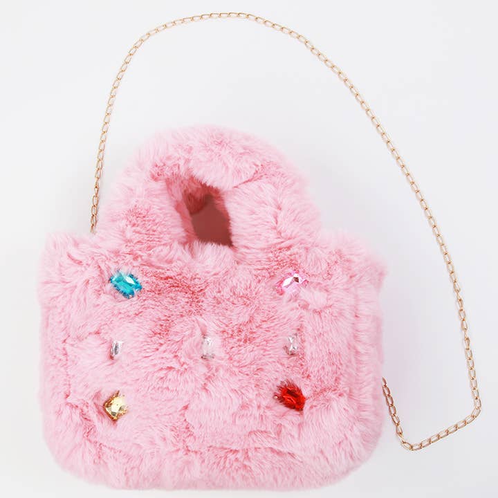 furry pink bag with handles and detachable gold strap. jewels all over the front of the bag