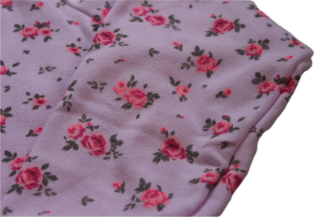 another close up of the pink sweatshirt with tiny hot pink roses on it. 