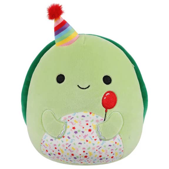 Plush toy turtle with a party hat and balloon 
