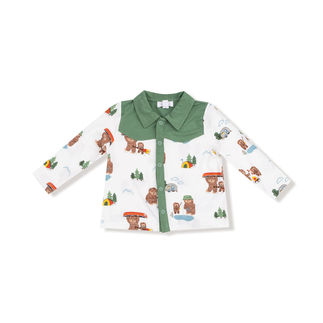 Children's shirt with bigfoot and nature pattern on a white background